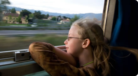 Girl gazing out of train window
